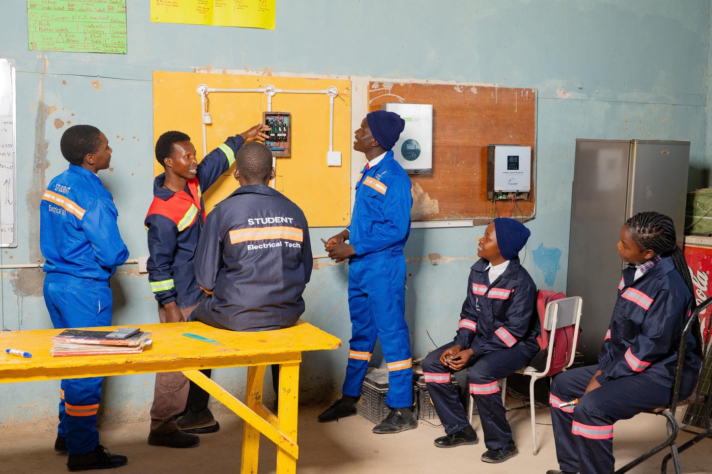 Students in motor mechanics practical class