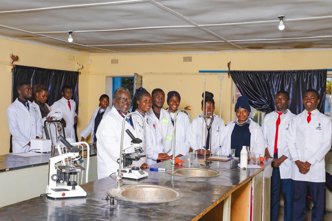 Students and staff members in sciences laboratory